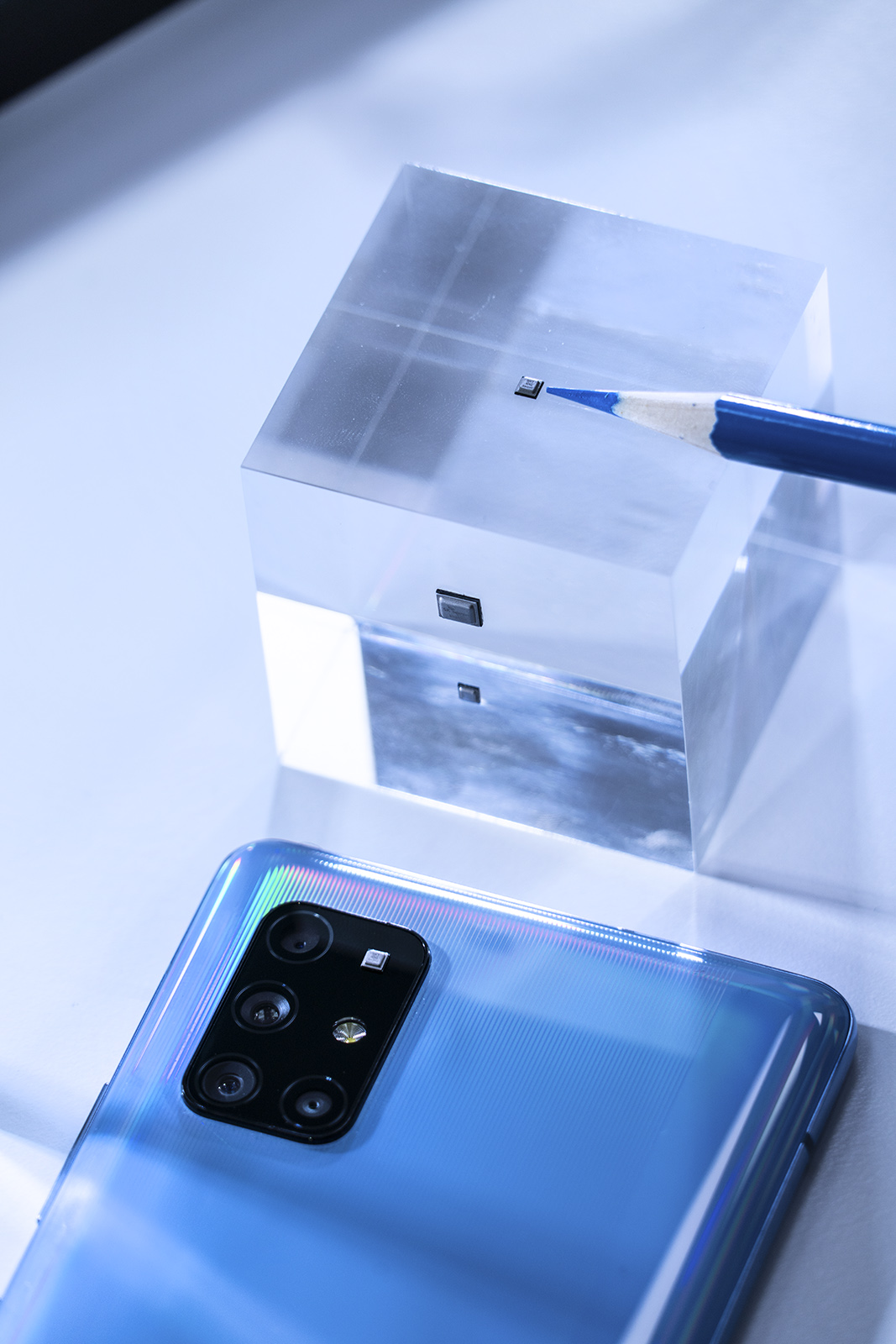 quantum chip phone next to pencil