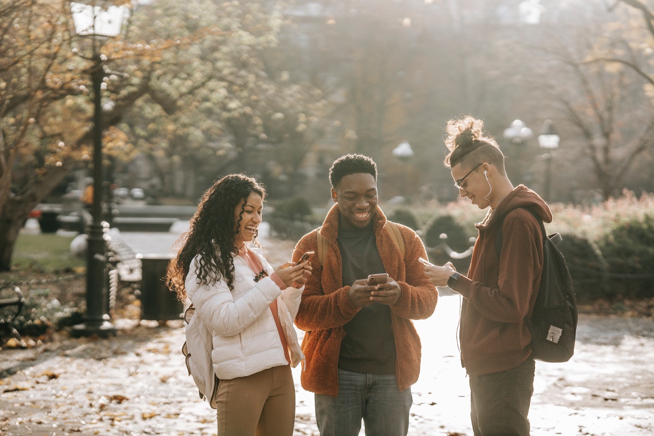 young people on the phone laughing in a post-quantum era